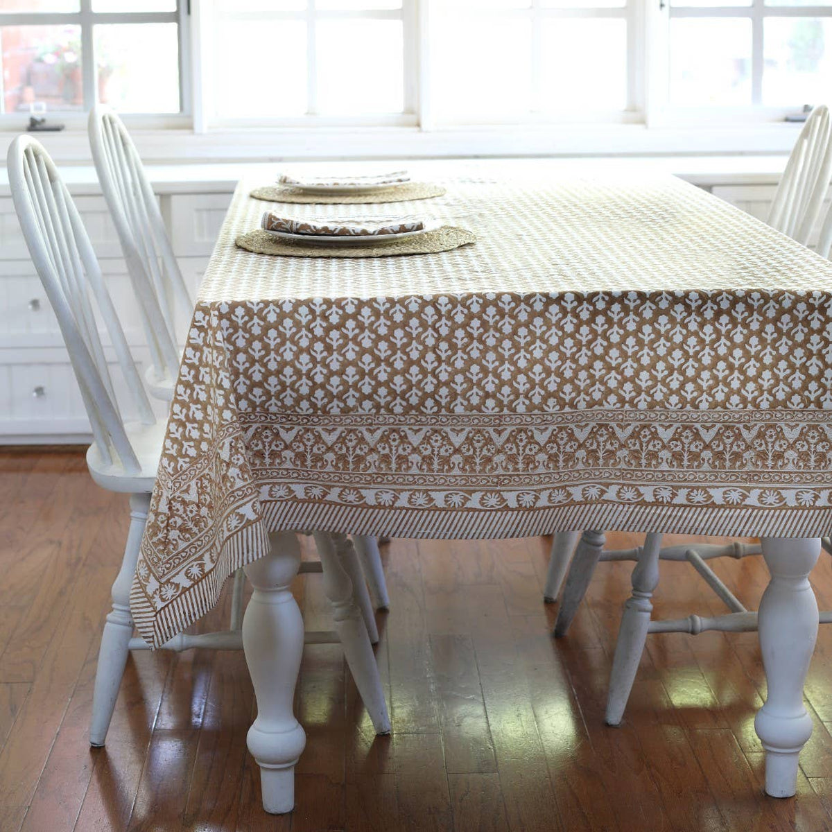 Charlotte Caramel Tablecloth on a table at Addison West