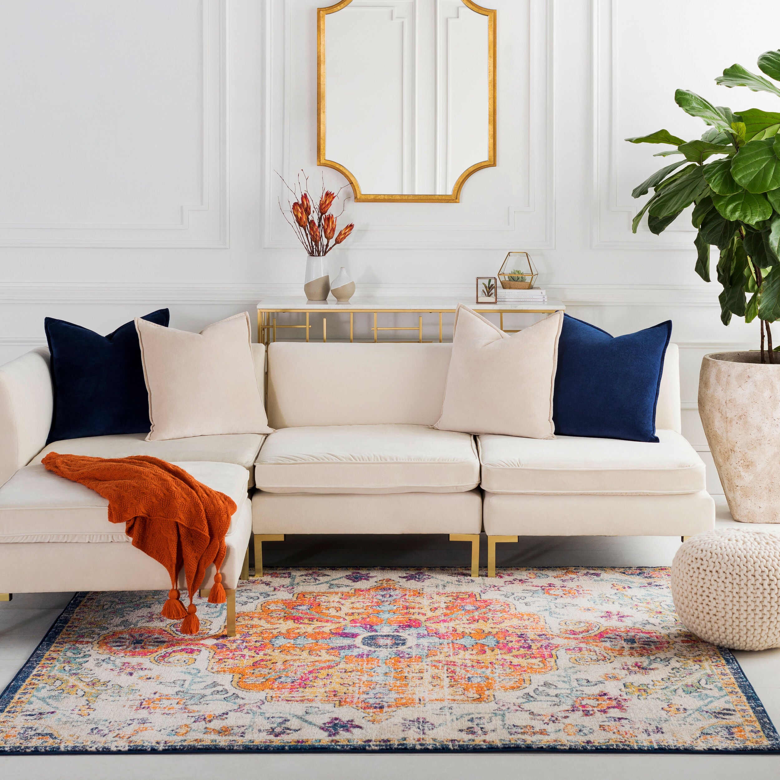 Joslyn Accent Mirror on a white background at Addison West on a white wall in a living room at Addison West