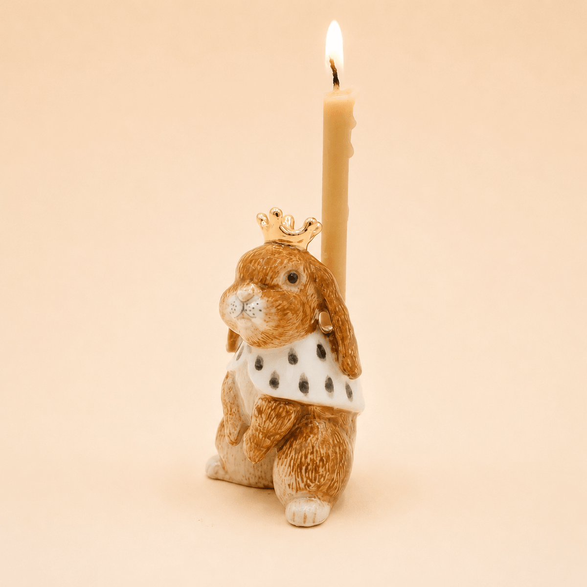 Camp Hollow Highness Hare Cake Topper on a beige background at Addison West