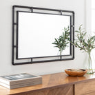 Indus Accent Mirror on a white wall above a table at Addison West