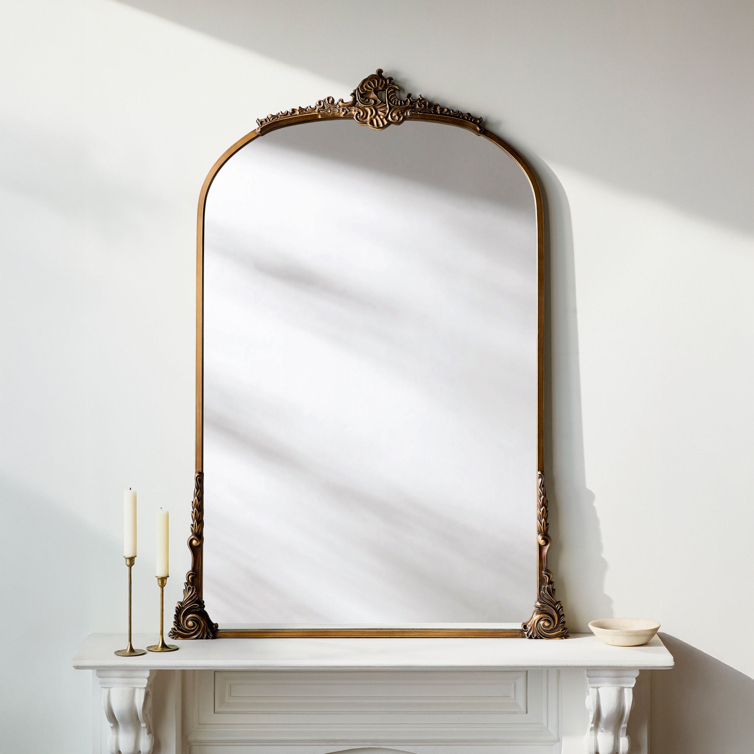 Nightingale Accent Mirror on a white mantle at Addison West