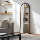 Noya Full Length Mirror in Natural Finish on a white wall in a living room at Addison West