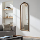 Noya Full Length Mirror in Natural Finish on a white wall in a living room at Addison West