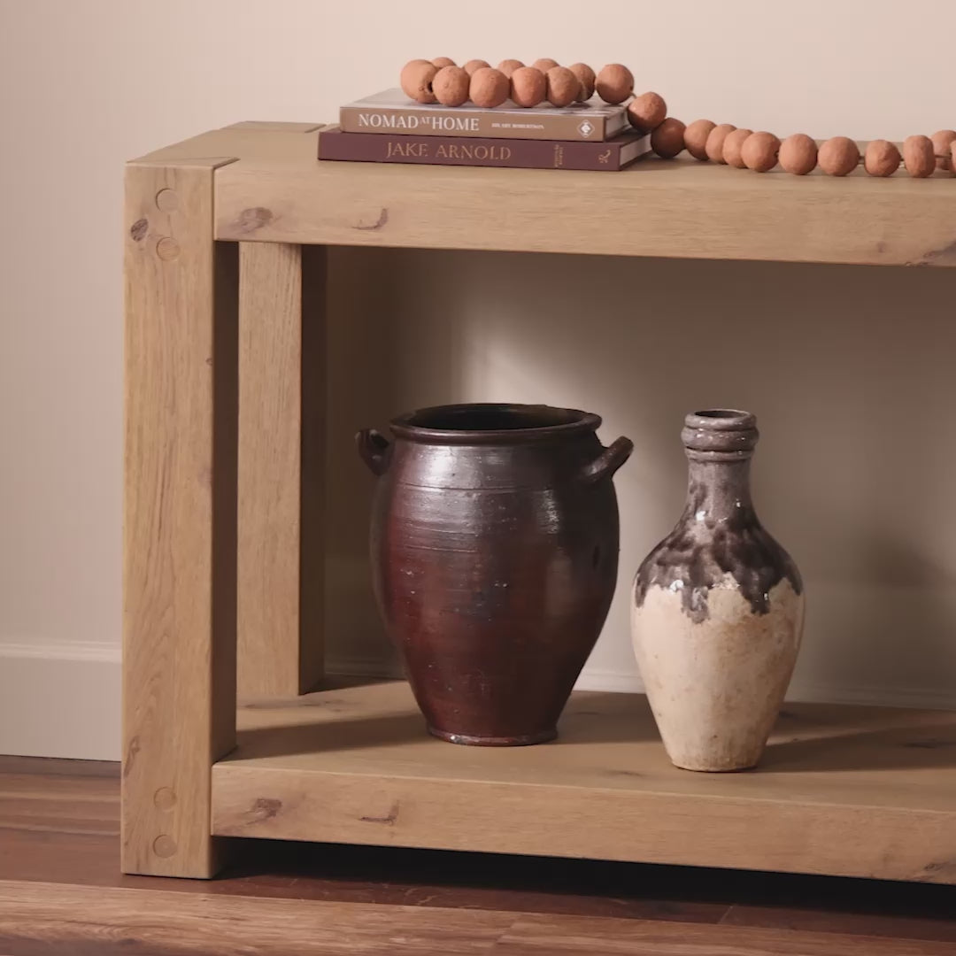 Four Hands Emmer Console Table in Aged Smoked Oak in a living room at Addison West