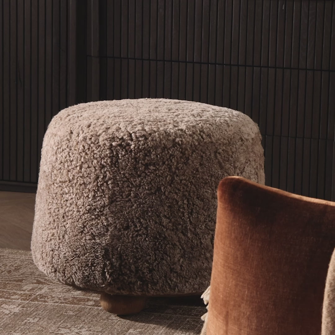Video of Four Hands Bilbury Ottoman in Taupe Shearling in a neutral living room at Addison West