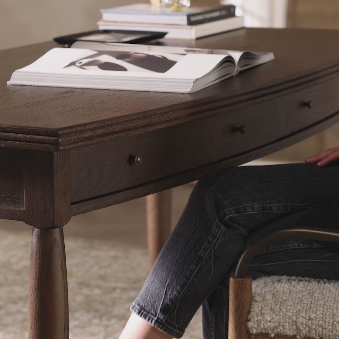 Four Hands Bowfront Desk in Drifted Oak Veneer in an office at Addison West