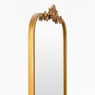 Close up of Aarlen Accent Mirror in Antiqued Gold on a white background at Addison West