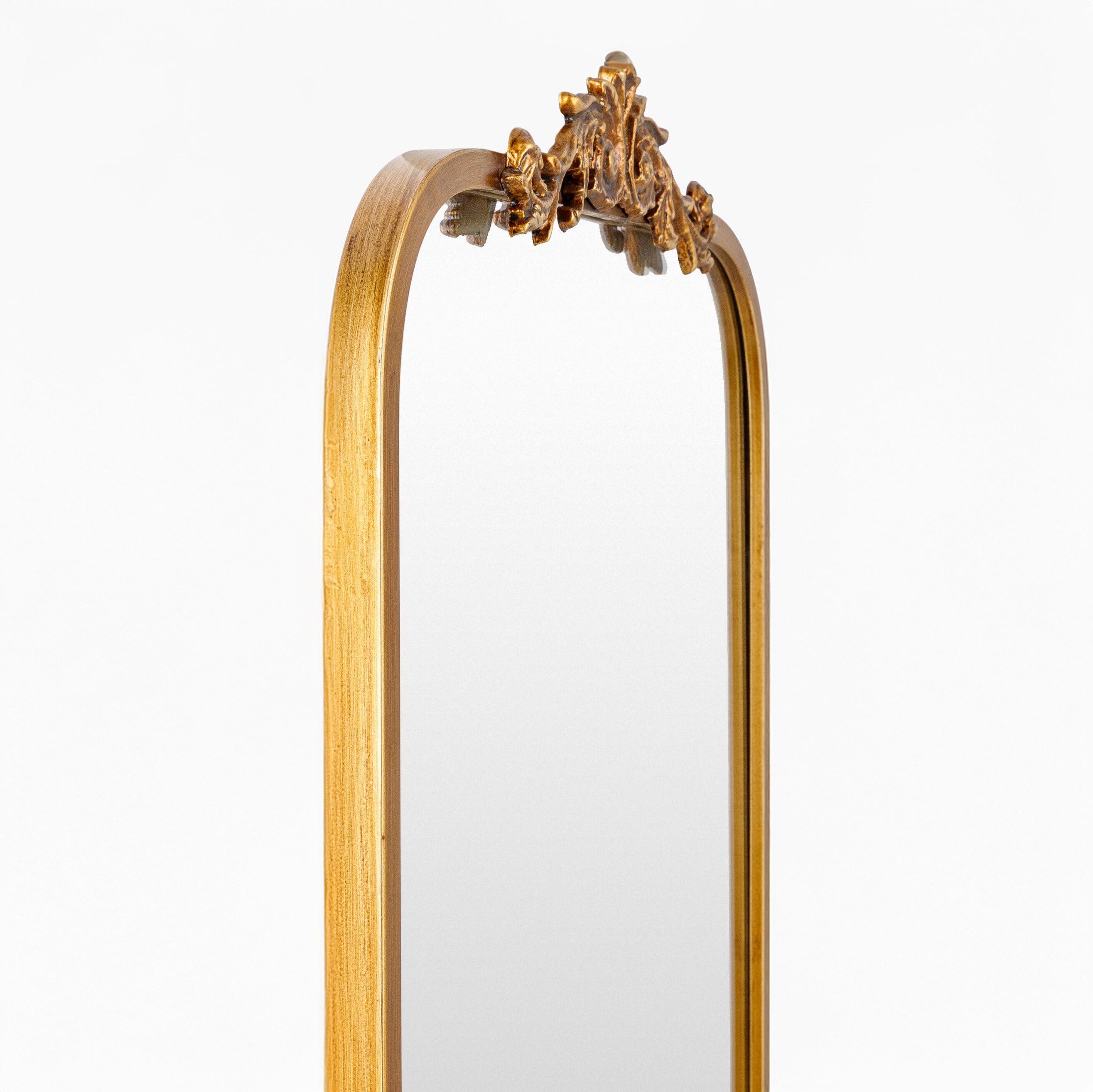 Close up of Aarlen Accent Mirror in Antiqued Gold on a white background at Addison West