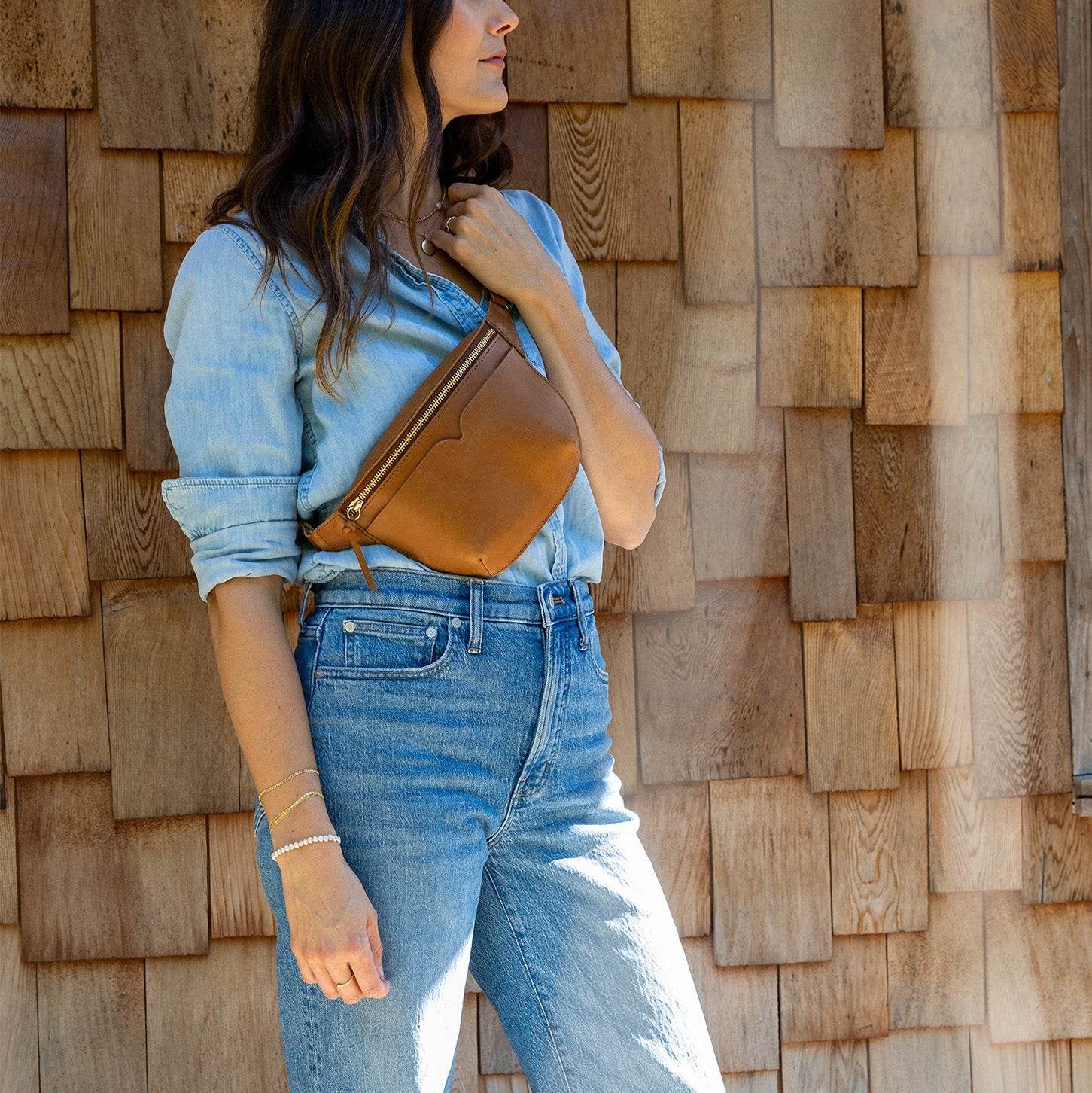 The Leather Sling Bag on a model at Addison West