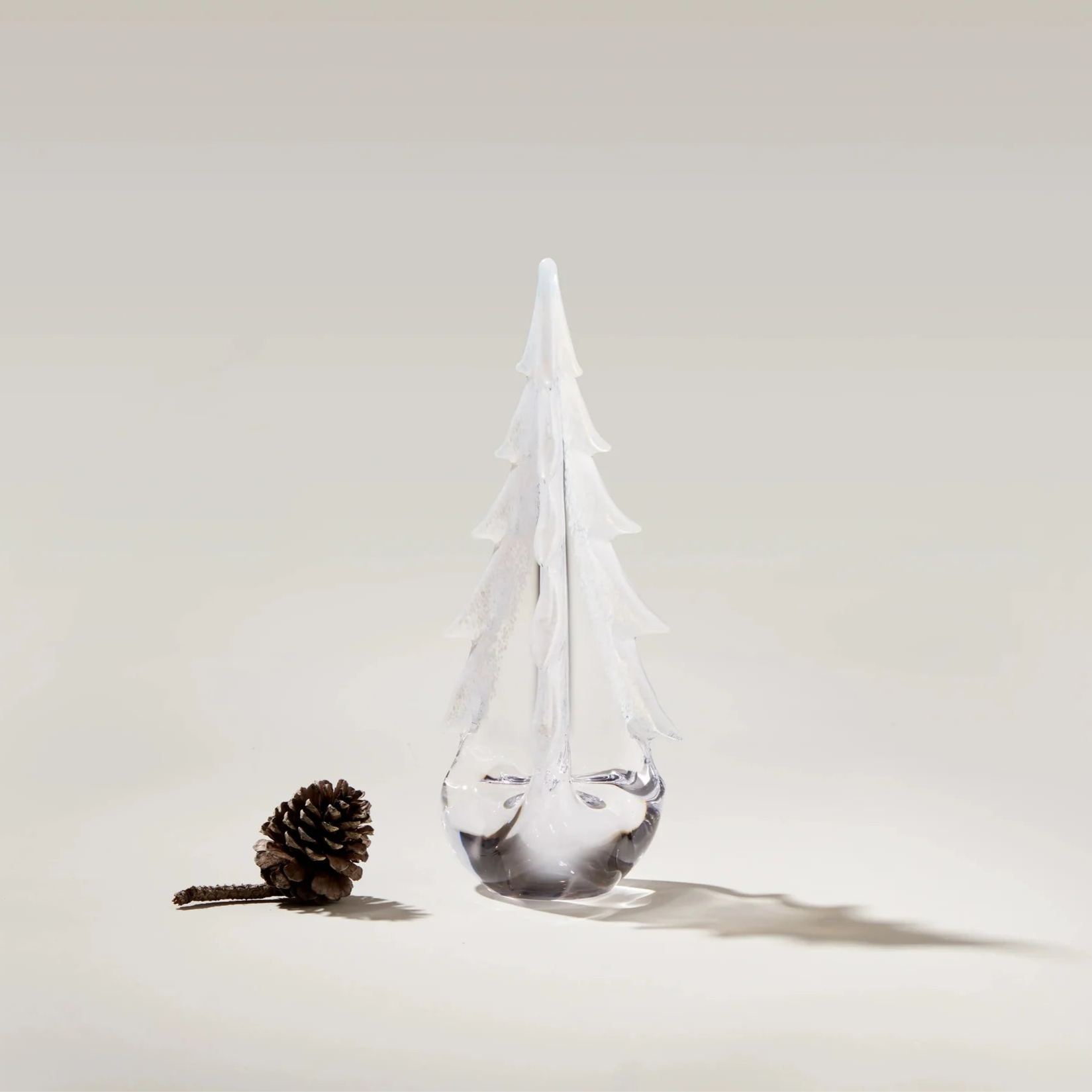 Snowy Branches Evergreen Glass Tree, 12" on a white background at Addison West on a white background at Addison West