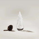 Snowy Branches Evergreen Glass Tree, 8" on a white background at Addison West