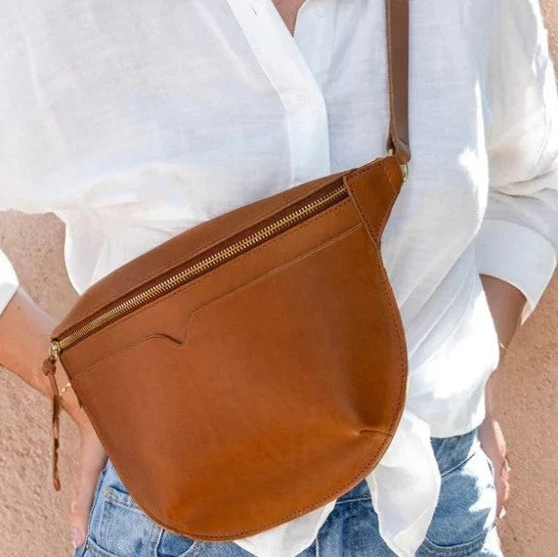 The Leather Sling Bag on a model at Addison West