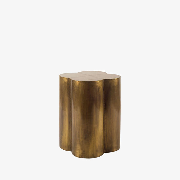 Clover shaped side table with brass cladding on a white background