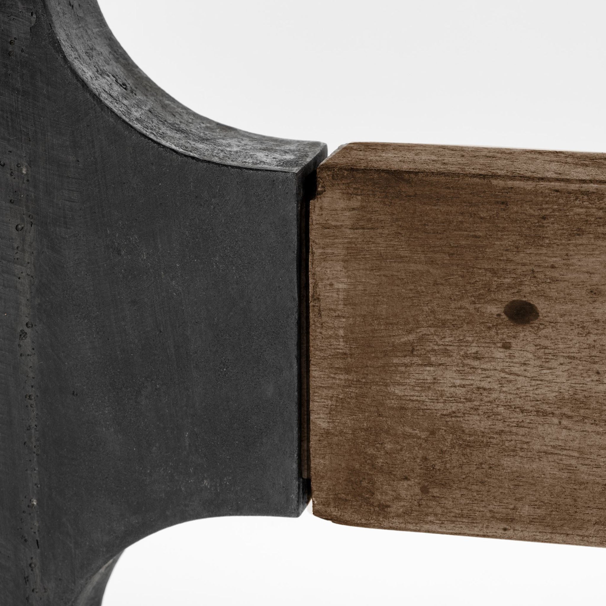 Large rectangular wood dining table with trestle style iron base on a white background