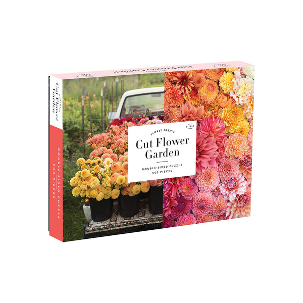 Floret farm cut flower garden puzzle with colorful blooms in buckets in back of pick up truck on a white background