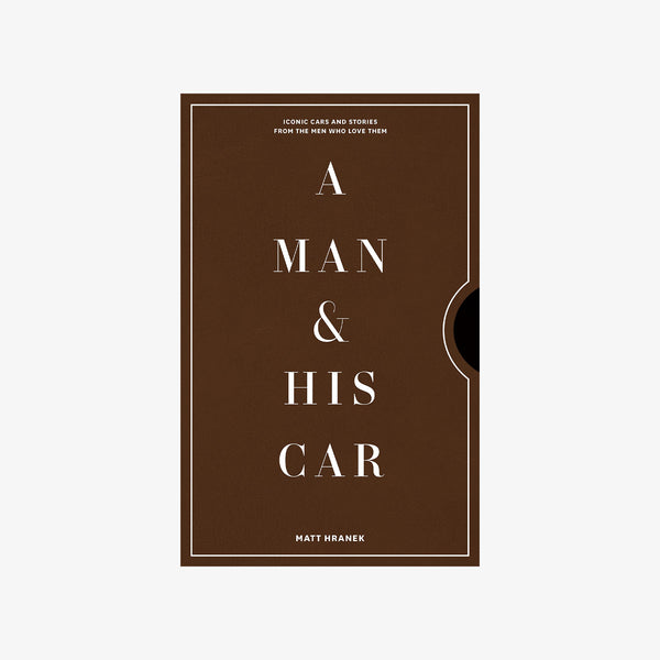 A man and his car book on a white background