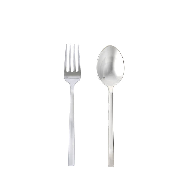 Stainless serving set with fork and spoon on a white background