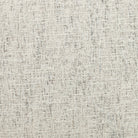 Close up of fabric on Four Hands Brand Astrud dining chair with pewter fabric seat and back and iron legs on a white background