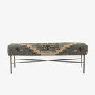 Long bench with patterned wool seat cover in muted charcoal green and cream on a white background