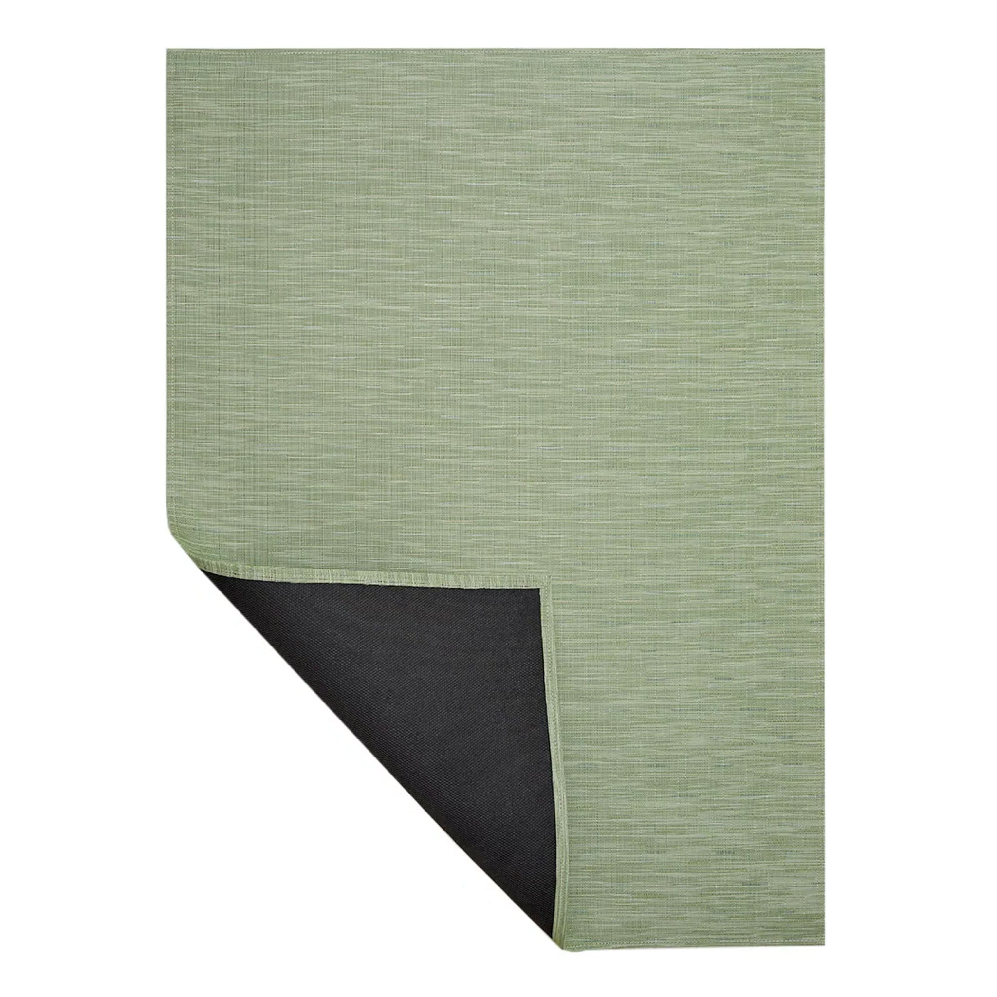 Chilewich bamboo woven floor mat in spring green on a white background