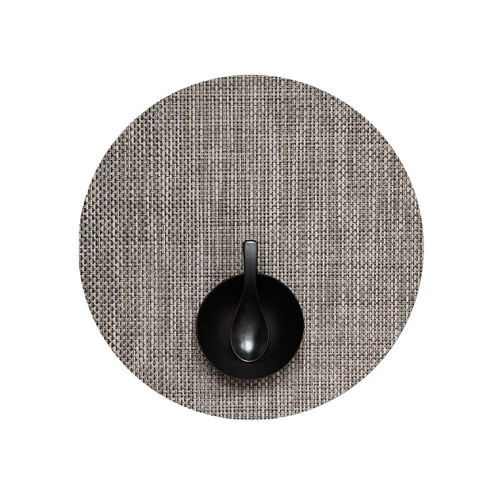 Chilewich round basket weave placemat in Oyster grey on a white background