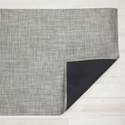 Chilewich basketweave floor mat in oyster on a light wood floor