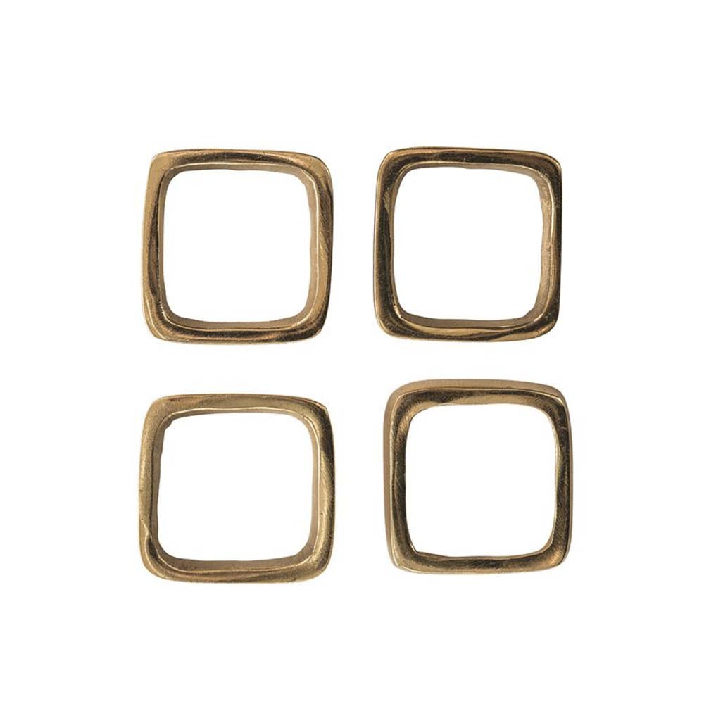 Set of four square brass finish metal napkin rings on a white background