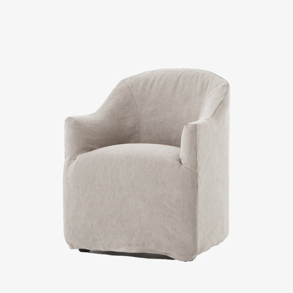 Four hands furniture brand cove dining chair with linen slip cover on a white background