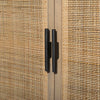 Close up of pulls on Four hands furniture brand 'Caprice' book case with light wood and rattan and doors