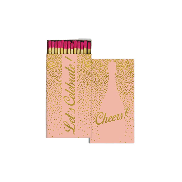 Pink box of matches with 'cheers' on cover in gold writing on a white background
