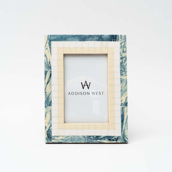 White and blue resin picture frame on a white background