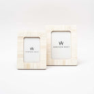 Set of two Zodax brand white bone inlay picture frames on a white background