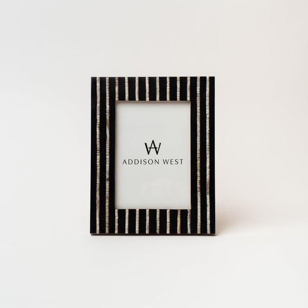 Picture frame with black and silver inlay stripes on a white background