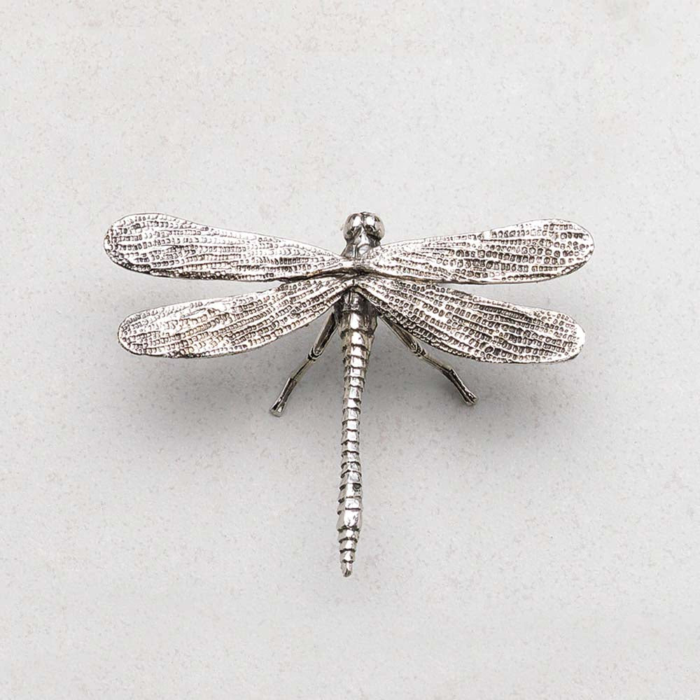 Close up of antique pewter dragon fly by Zodax on a white background