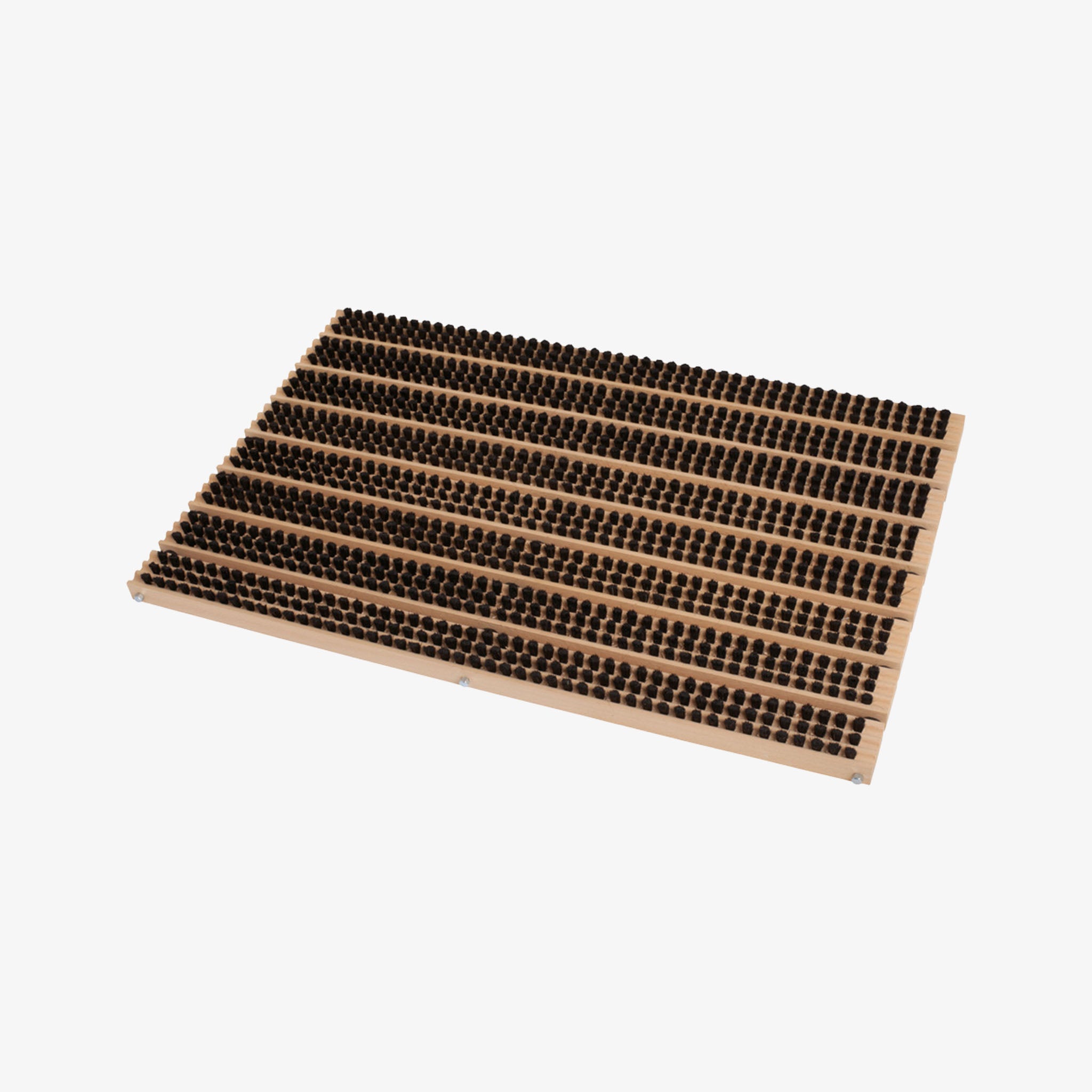 Beechwood and bristle door mat on a white background