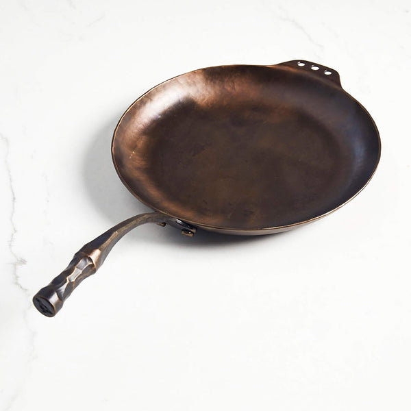 Smithey farmhouse carbon steep skillet on a white background