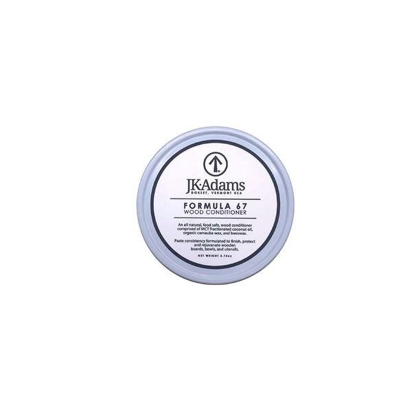 Tin of wood conditioner for salad bowls and cutting boards on a white background