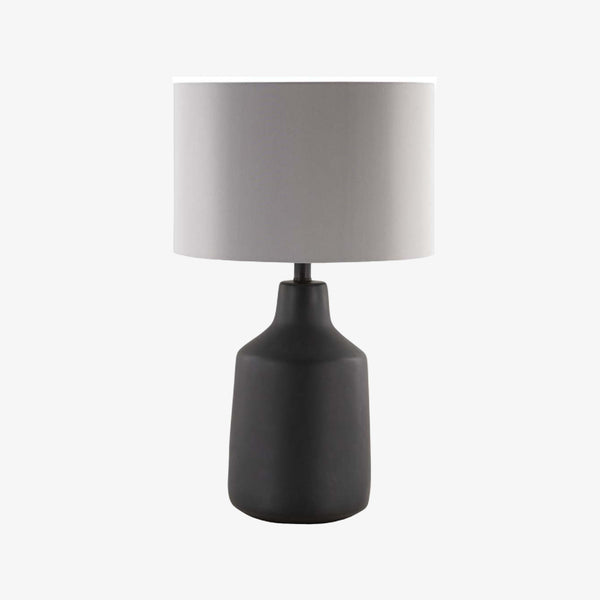 Surya Foreman FMN-100 lamp in hand finished dark matte black on a white background  Edit alt text