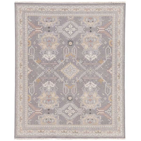 Jaipur wool JAIMAK rug with Pops of gold and dusty pink on gray backdrop with classic fringe