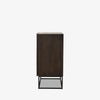 Kelby brown wood bar cabinet with carved doors and black iron frame base by four hands on a white background