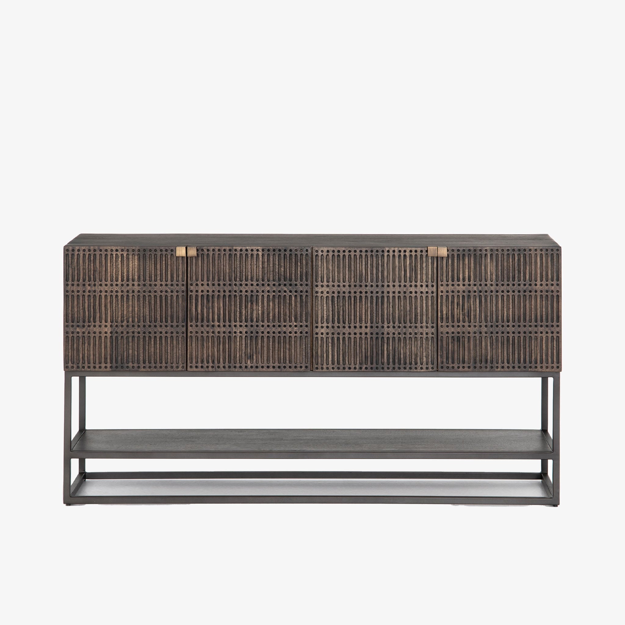 Four hands furniture brand Kelby media console with iron base and four carved doors with square brass pulls on a white background
