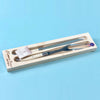 Laguiole ivory carving set in wood box with acrylic lid on a blue background