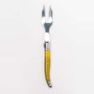 Yellow Laguiole cheese fork on a white background
