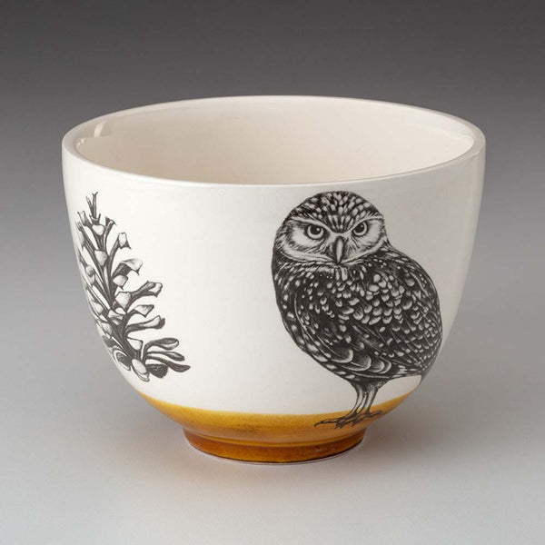 Small white bowl with burrowing owl and amber base by Laura Zindel
