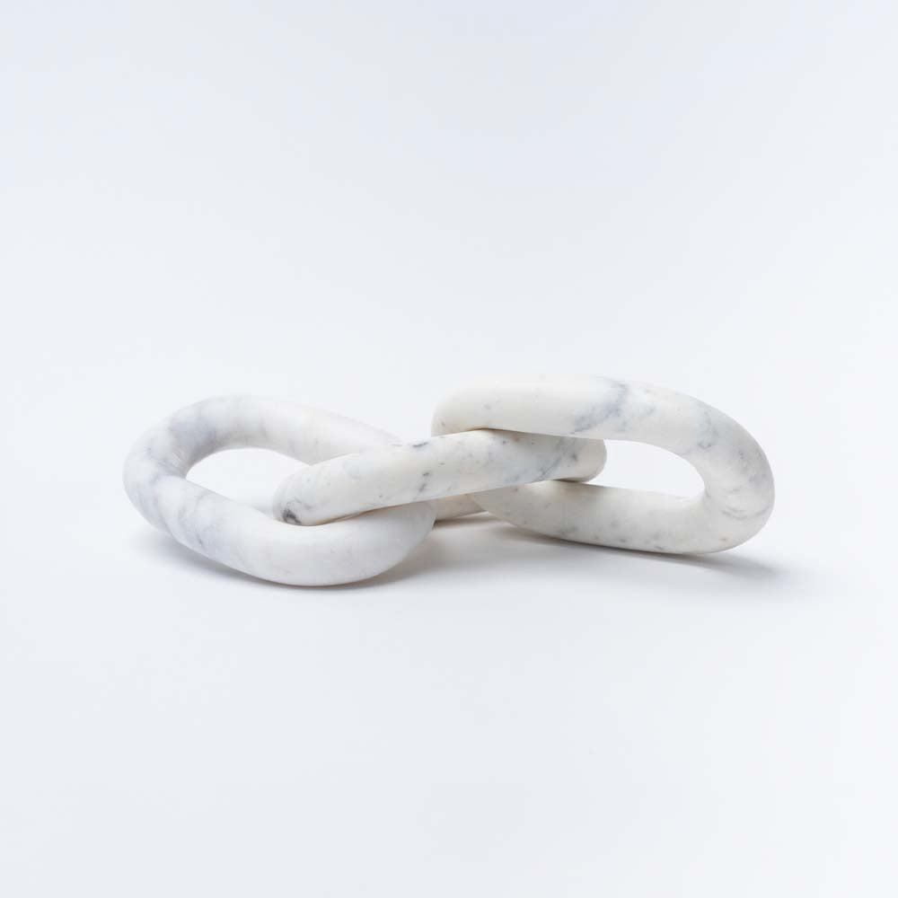White marble chain decorative links by Bloomingville on a white background