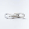 White marble chain decorative links by Bloomingville on a white background