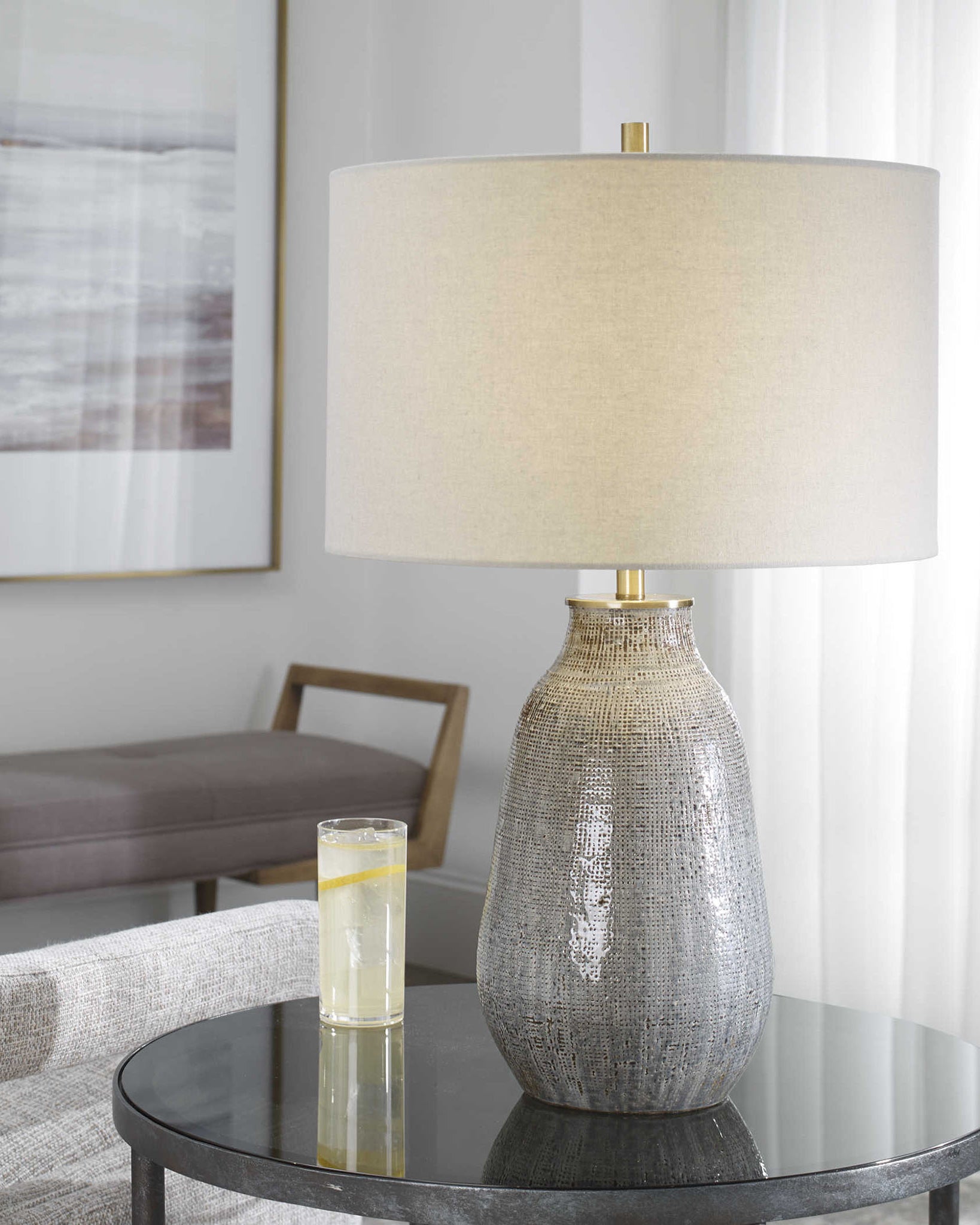 Moynahan Table Lamp on an end table in a living room at Addison West