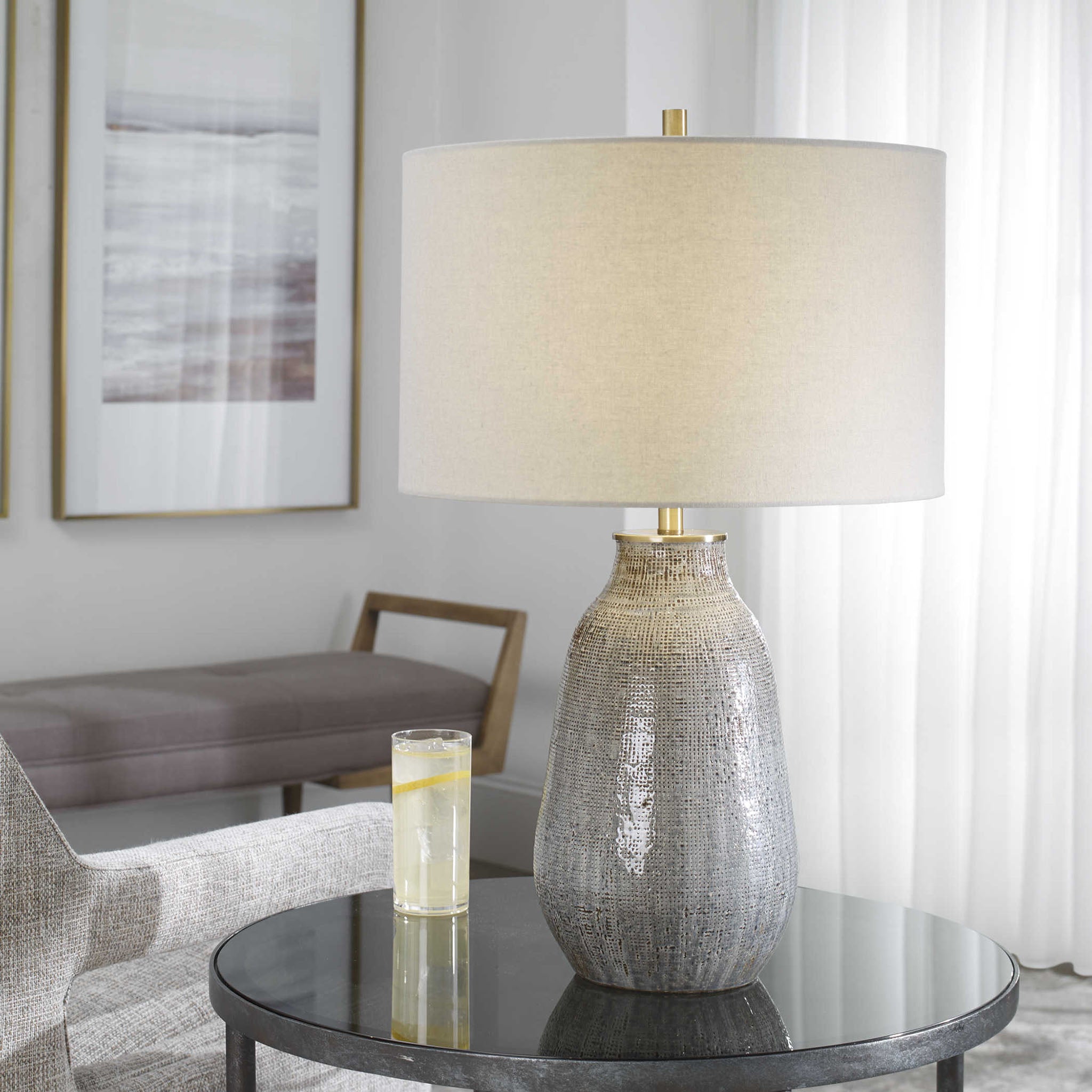 Moynahan Table Lamp on an end table in a living room at Addison West