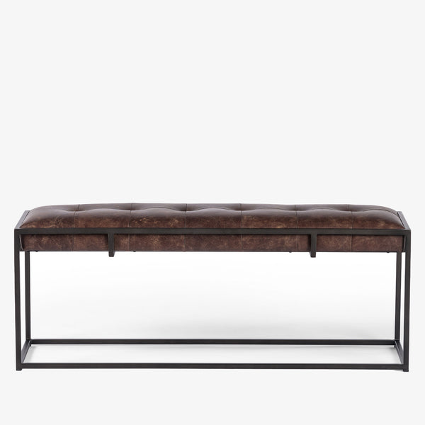 Four hands brand Oxford bench with iron frame and brown leather top on a white background