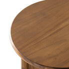 Stained acacia wood round end table with two rounded legs by four hands furniture on a white background